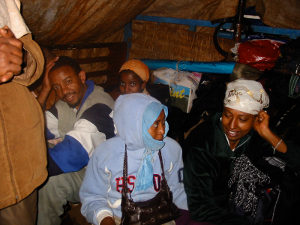 Negussie, Etetu and Emmawayish going to Assosa on 26 August 2005. They had to finish their drive in a truck after the public bus they were in broke down at Mendi.